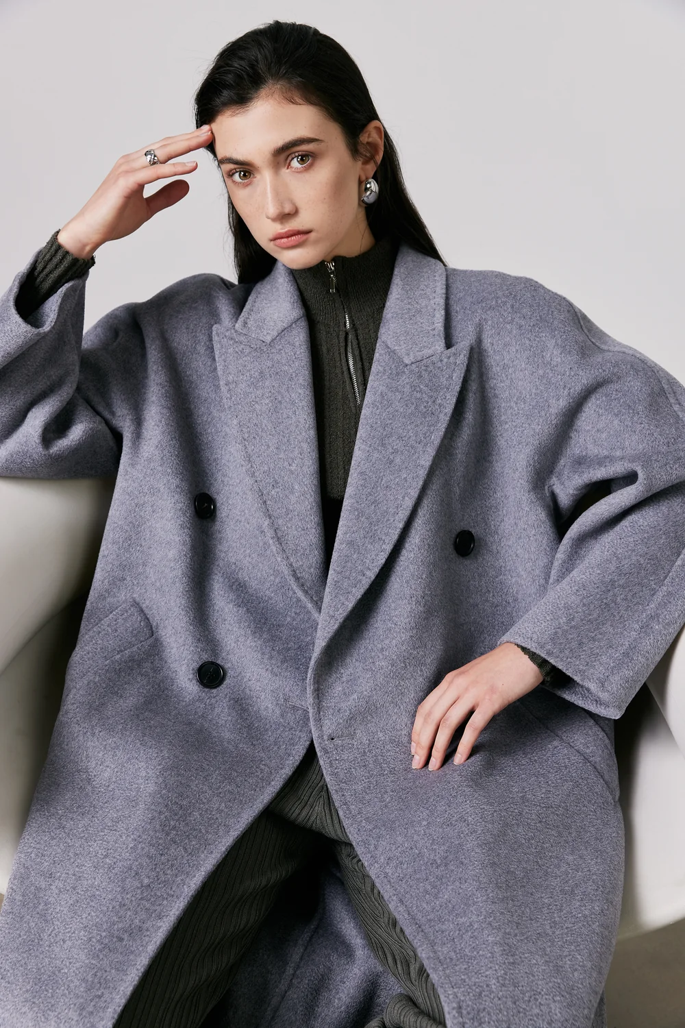 Grey TINGSU coat on model, showing the lapel and double-breasted front