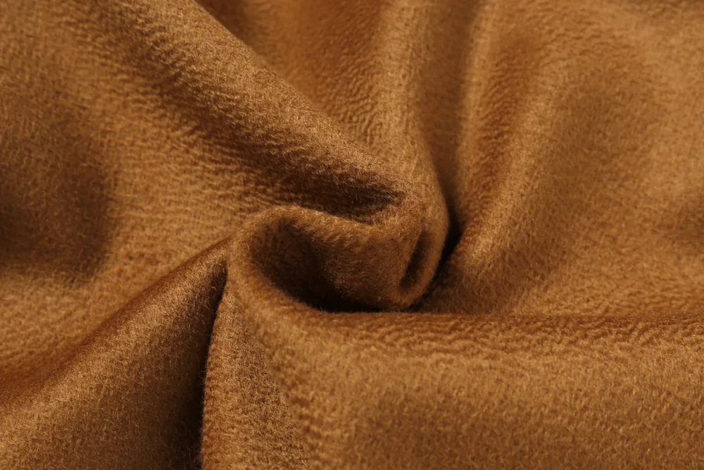 Brown fabric photographed for TINGSU, showing the brushed ripple surface
