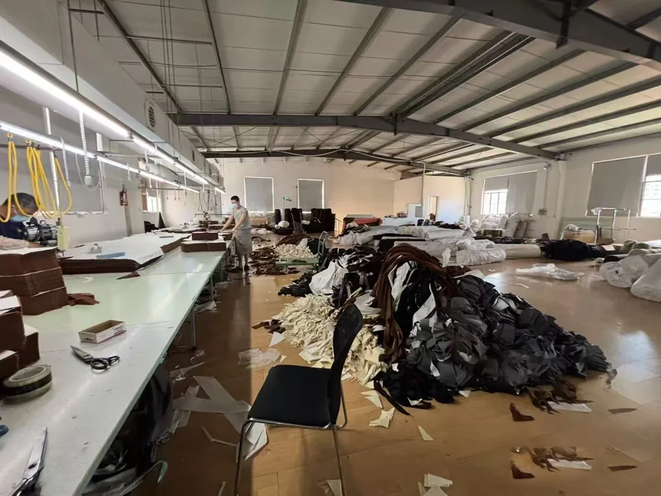 Cutting-room tables with fabric pieces and offcuts in the work area